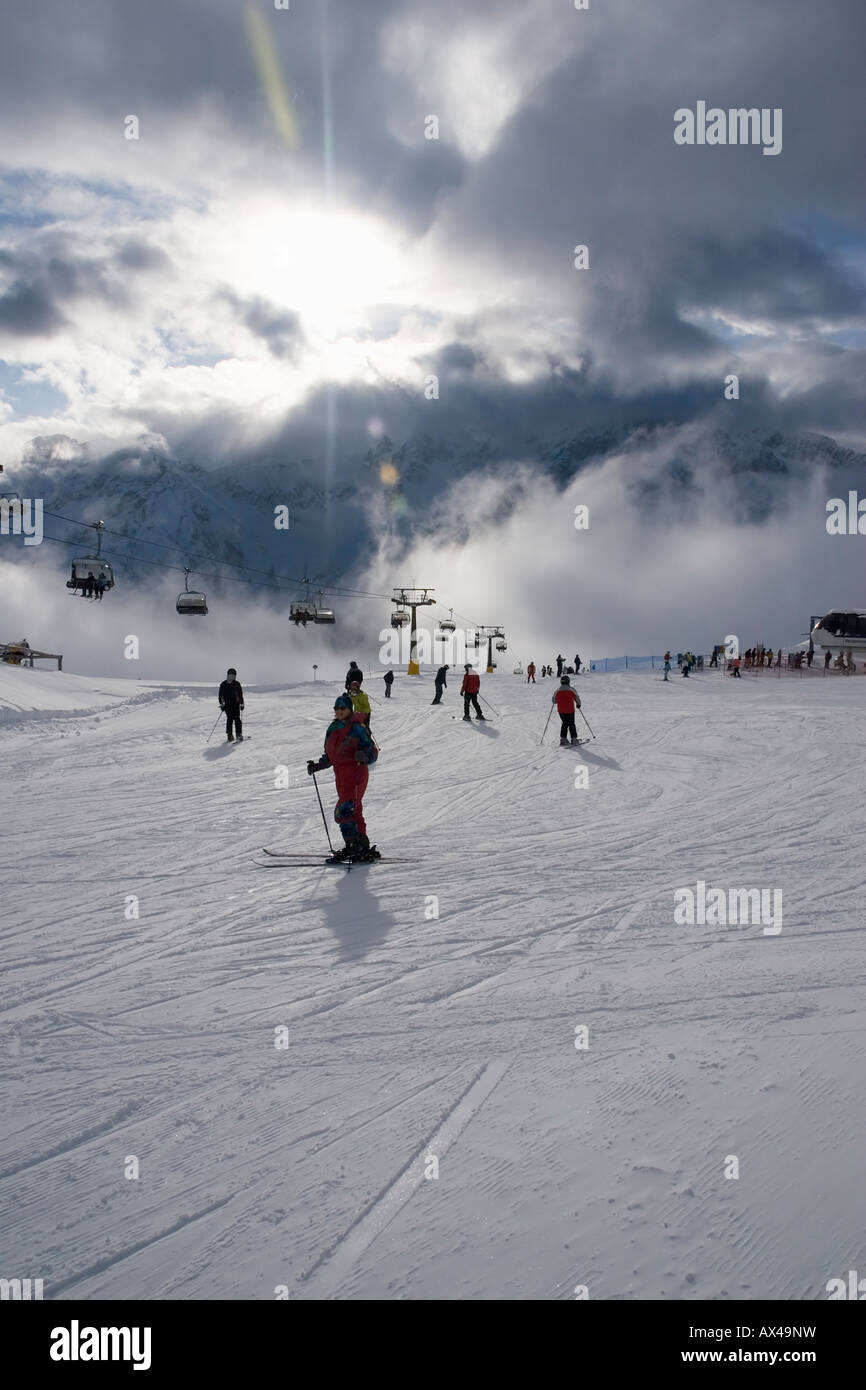 Skiers on Valbiolo blue run Passo del Tonale Stock Photo