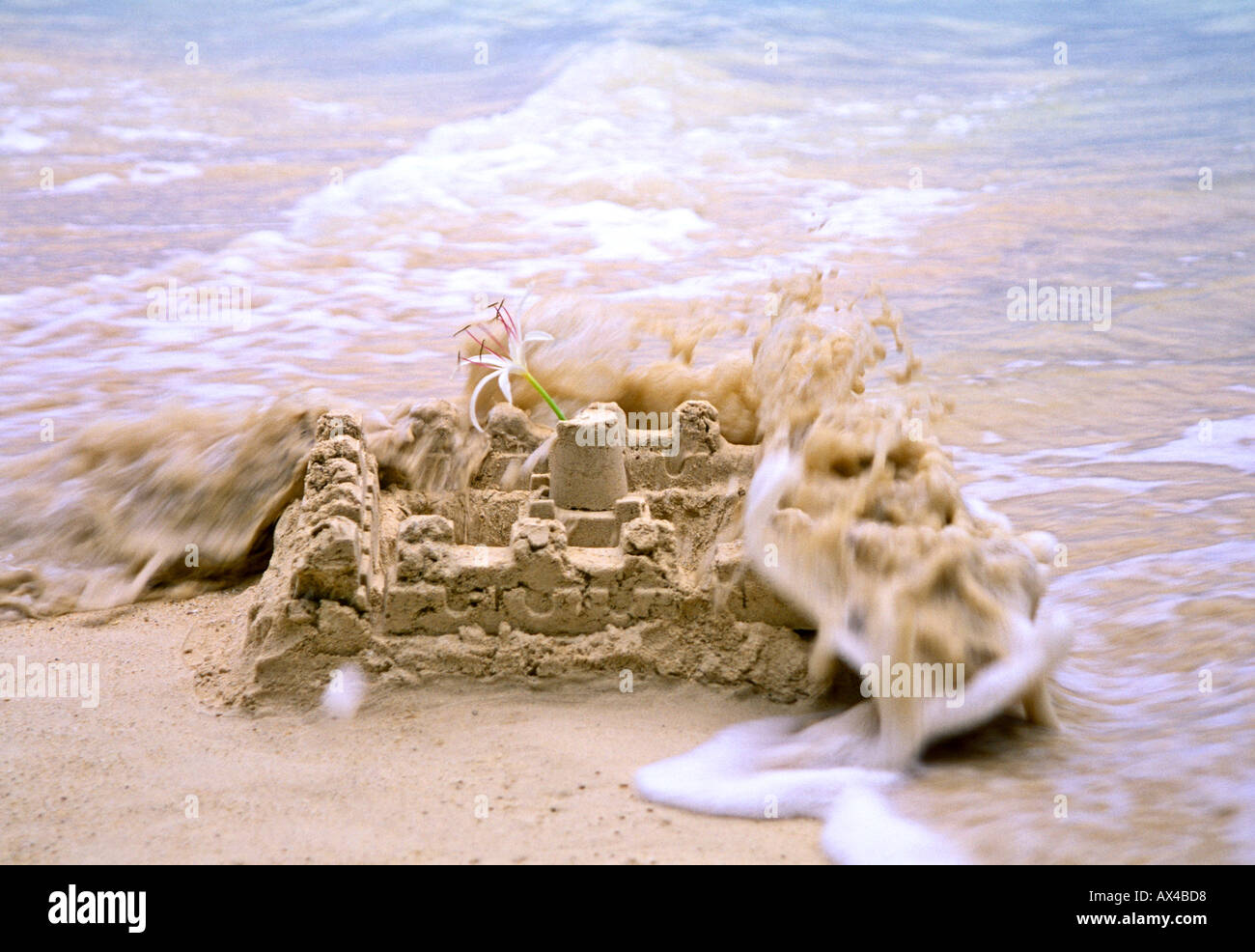 Sand Castle Being Washed Away Stock Photo Alamy