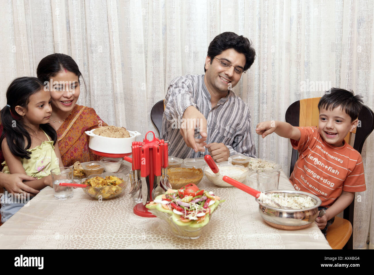 Indian family eating food hi-res stock photography and images - Alamy