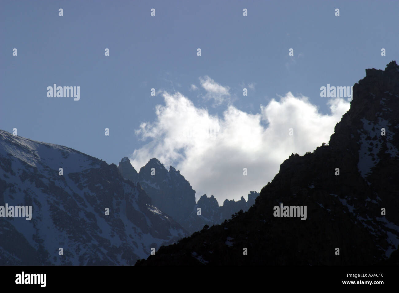 Mountain silhouettes and clouds in the eastern Sierra near Independence California Stock Photo