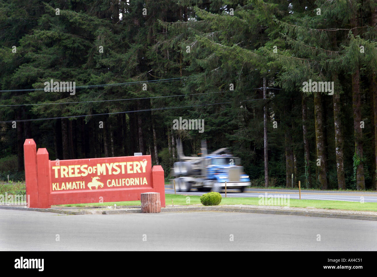 A logging truck on Highway 101 passes Trees of Mystery in Klamath