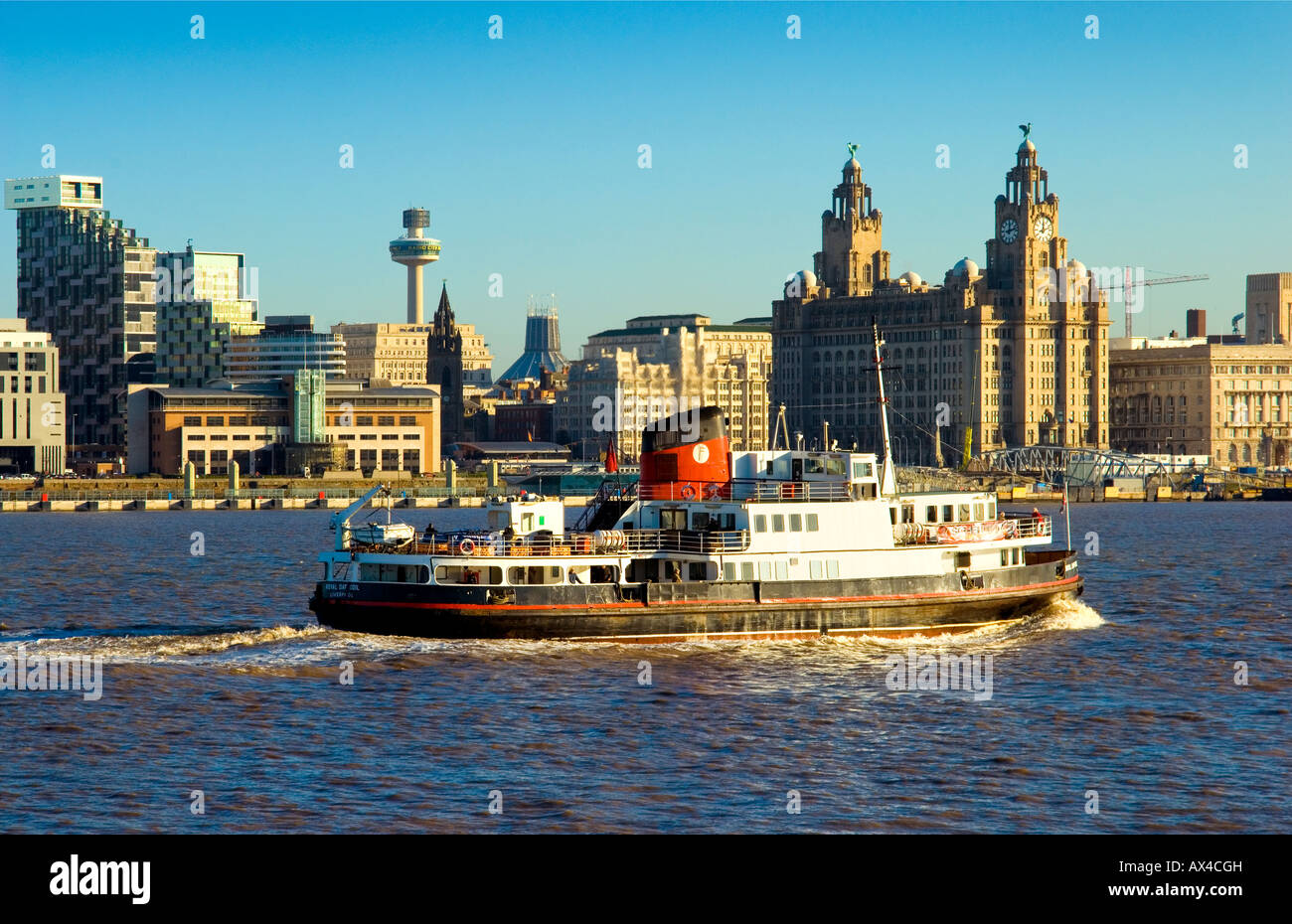 Liverpool ferry passing in front of the Liver building and contemporary