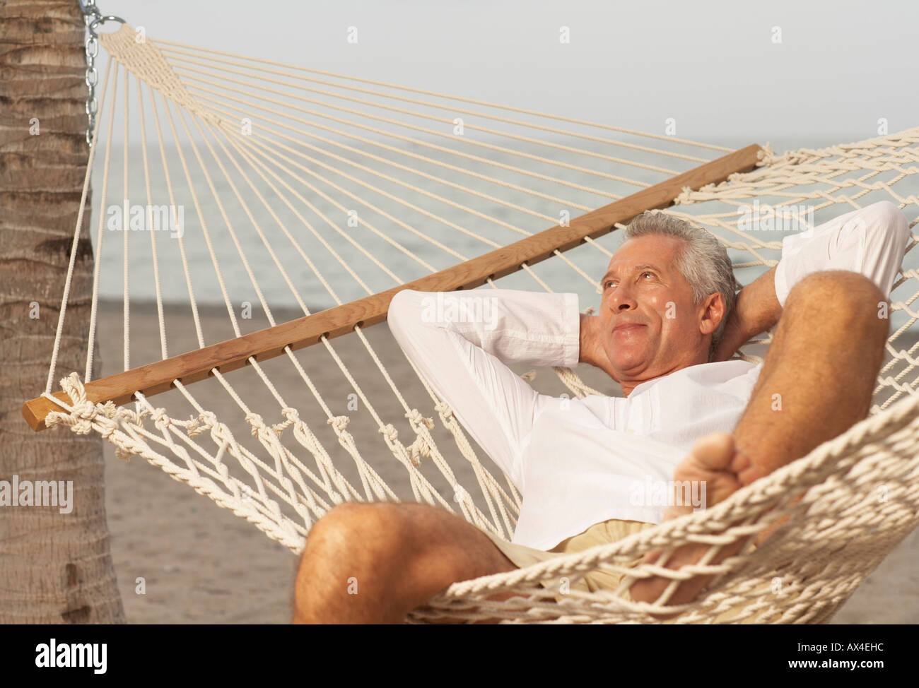 Senior Man Relaxing In Hammock High Resolution Stock Photography and ...