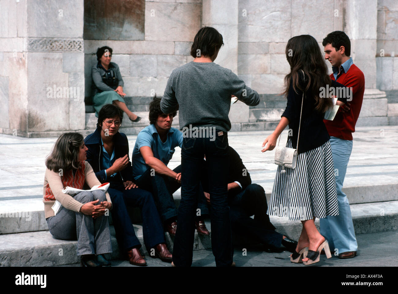 Students having a discussion on some steps in Italy Stock Photo
