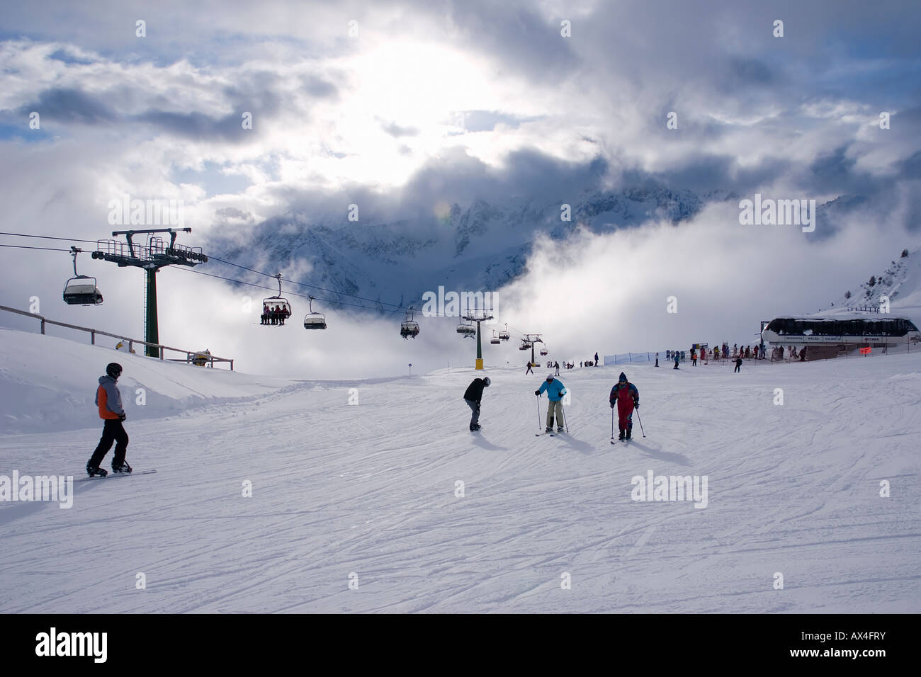 Skiers on Valbiolo blue run Passo del Tonale Stock Photo