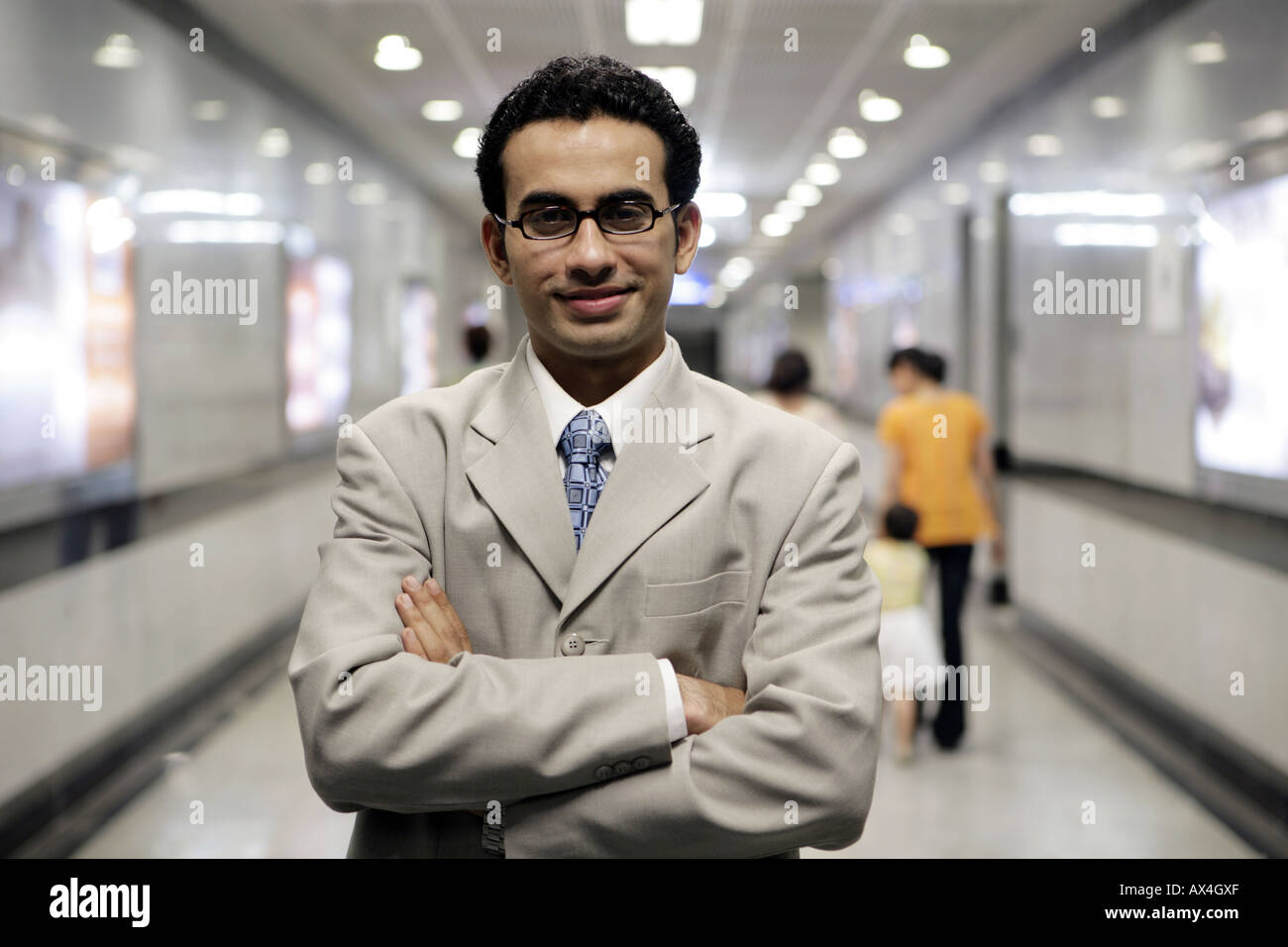 Portrait of a businessman standing with his arms crossed Stock Photo ...