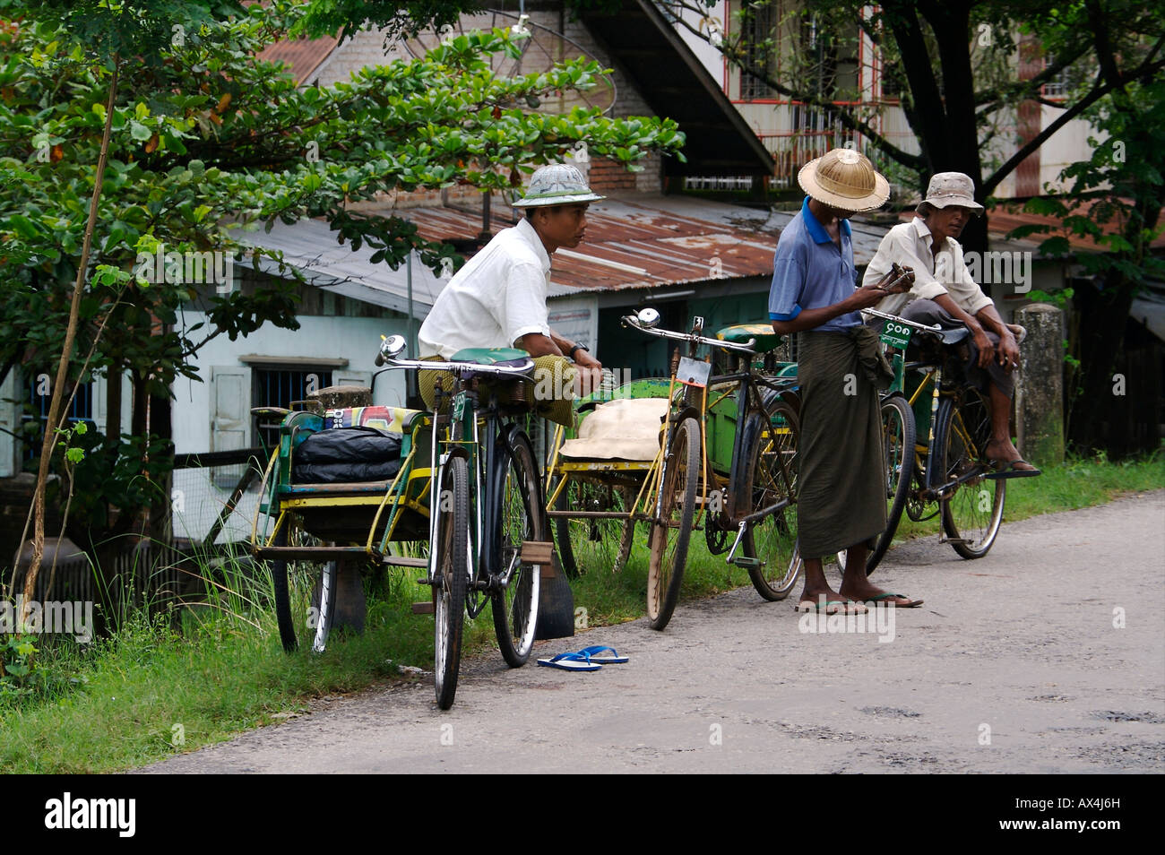 Tricycles drivers outside Bago Stock Photo - Alamy