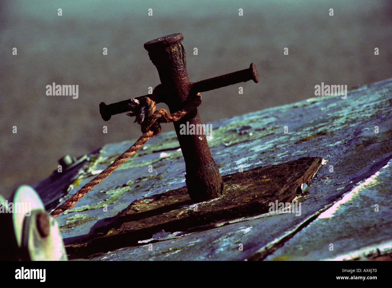 Rope and Rusty Stanchion on Derelict Boat. Stock Photo