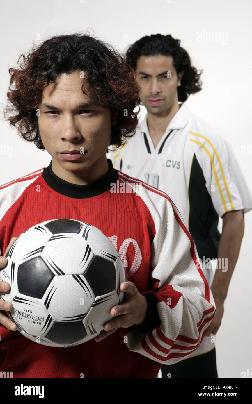 Two football player standing in attitude pose Stock Photo Alamy