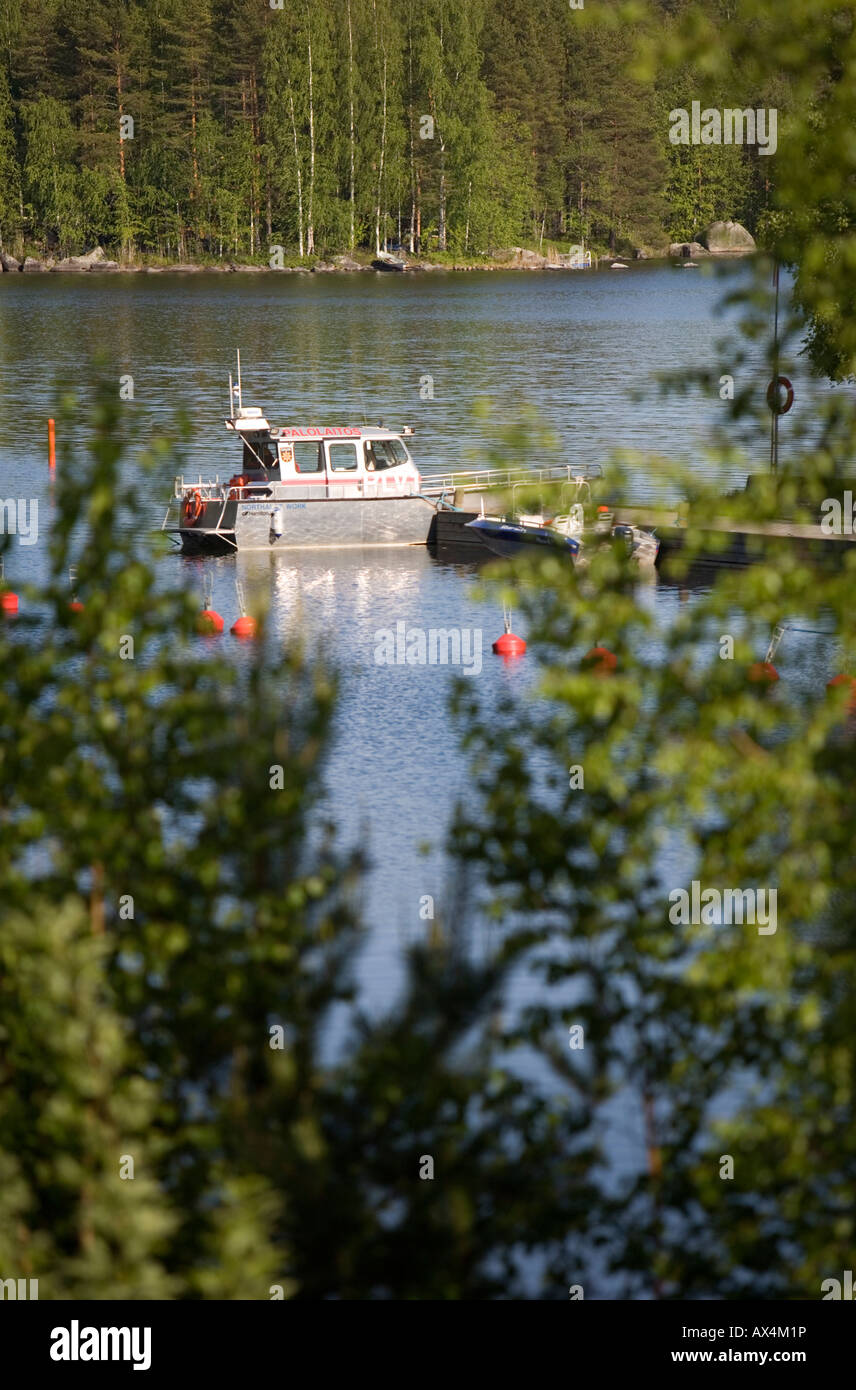 Fire department search and rescue vessel (SAR) moored in a small boat harbor at lake Konnevesi  at Summer , Finland Stock Photo