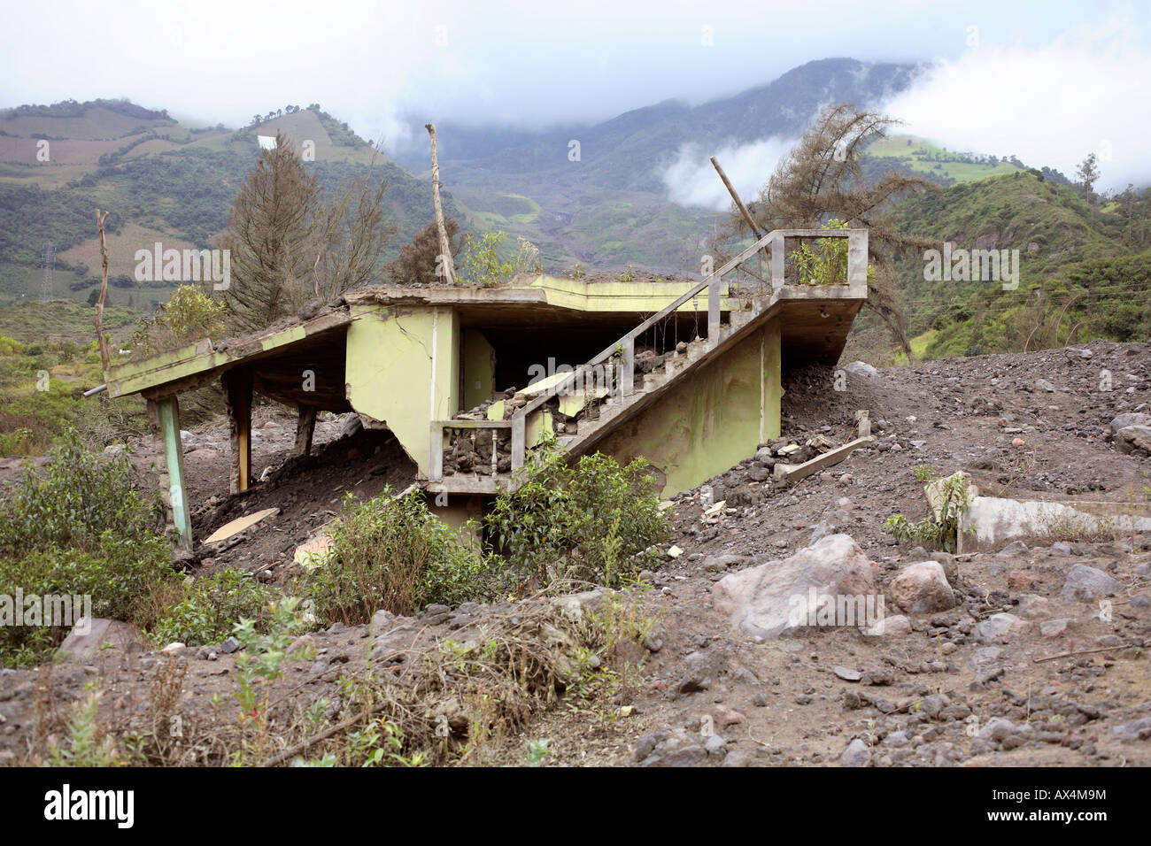 House buried in a lahar or mudflow on the slopes of Tunguragua Volcano, Ecuador Stock Photo