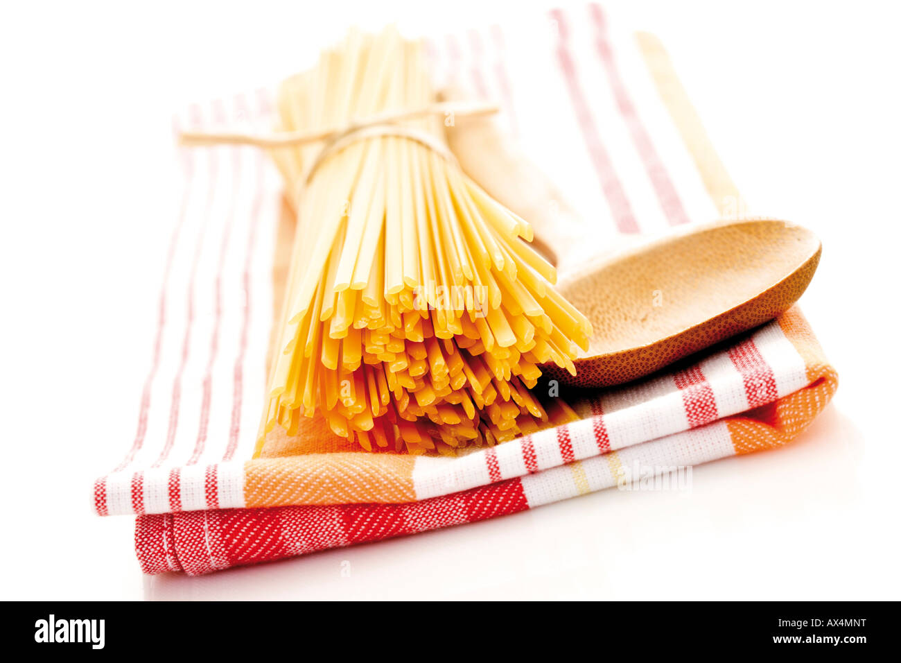 https://c8.alamy.com/comp/AX4MNT/bunch-of-pasta-on-dish-cloth-close-up-AX4MNT.jpg