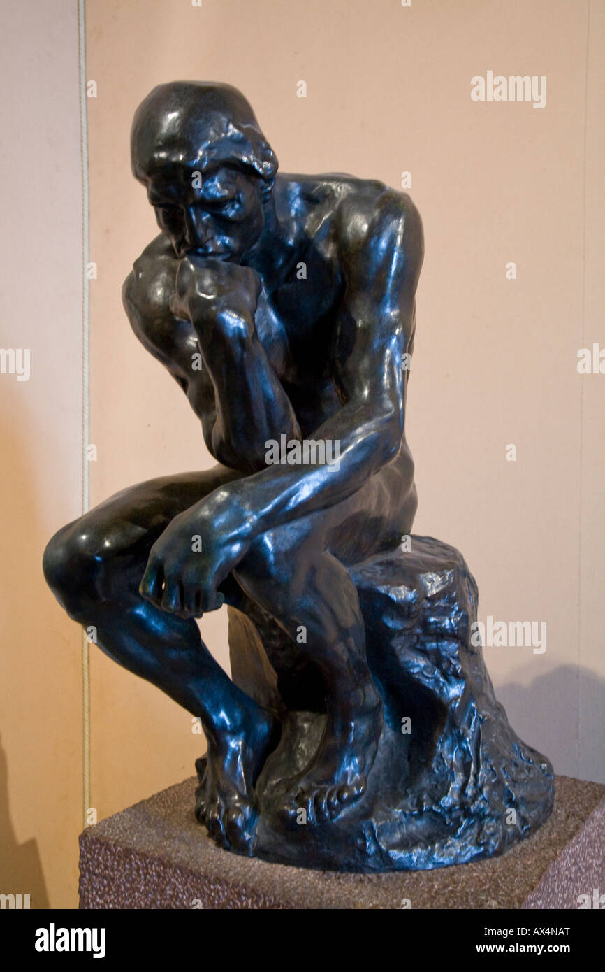 Small bronze statue of The Thinker by August Rodin housed in the ...