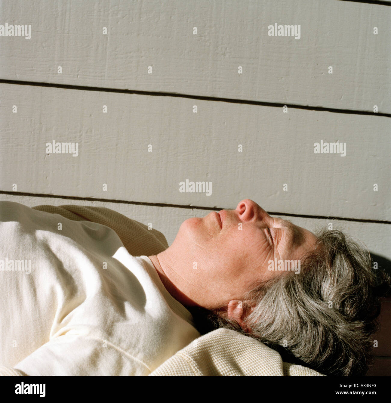 Woman lying down on back Stock Photo