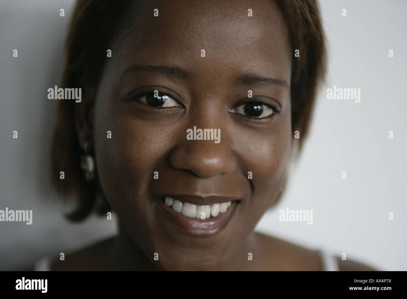 Smiling woman wearing tank hi-res stock photography and images - Alamy