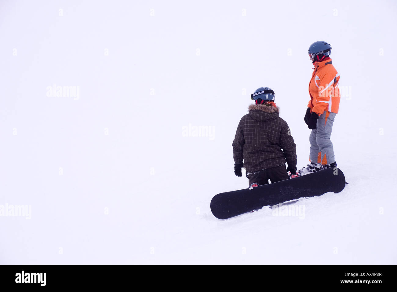 Snowboarders on piste in Passo del Tonale Stock Photo