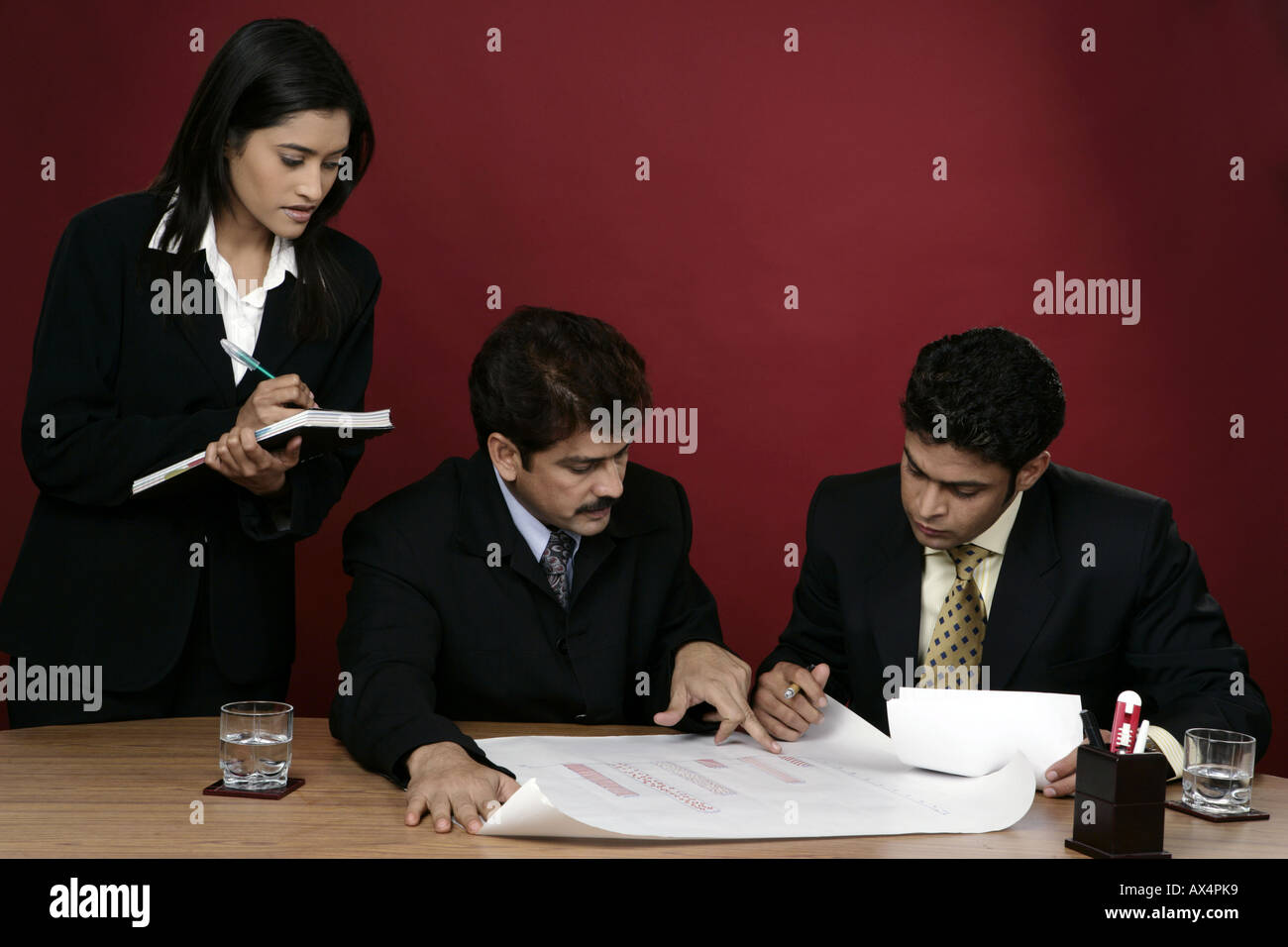 Three business people working in an office Stock Photo