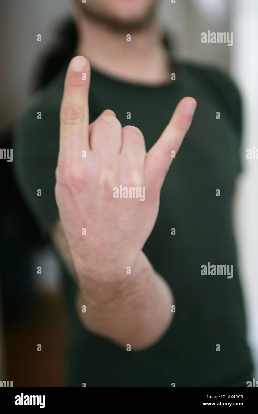 Man making hand gesture Stock Photo