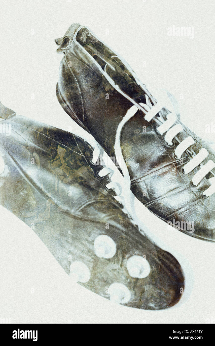 Vintage black football boots photo-illustration Stock Photo