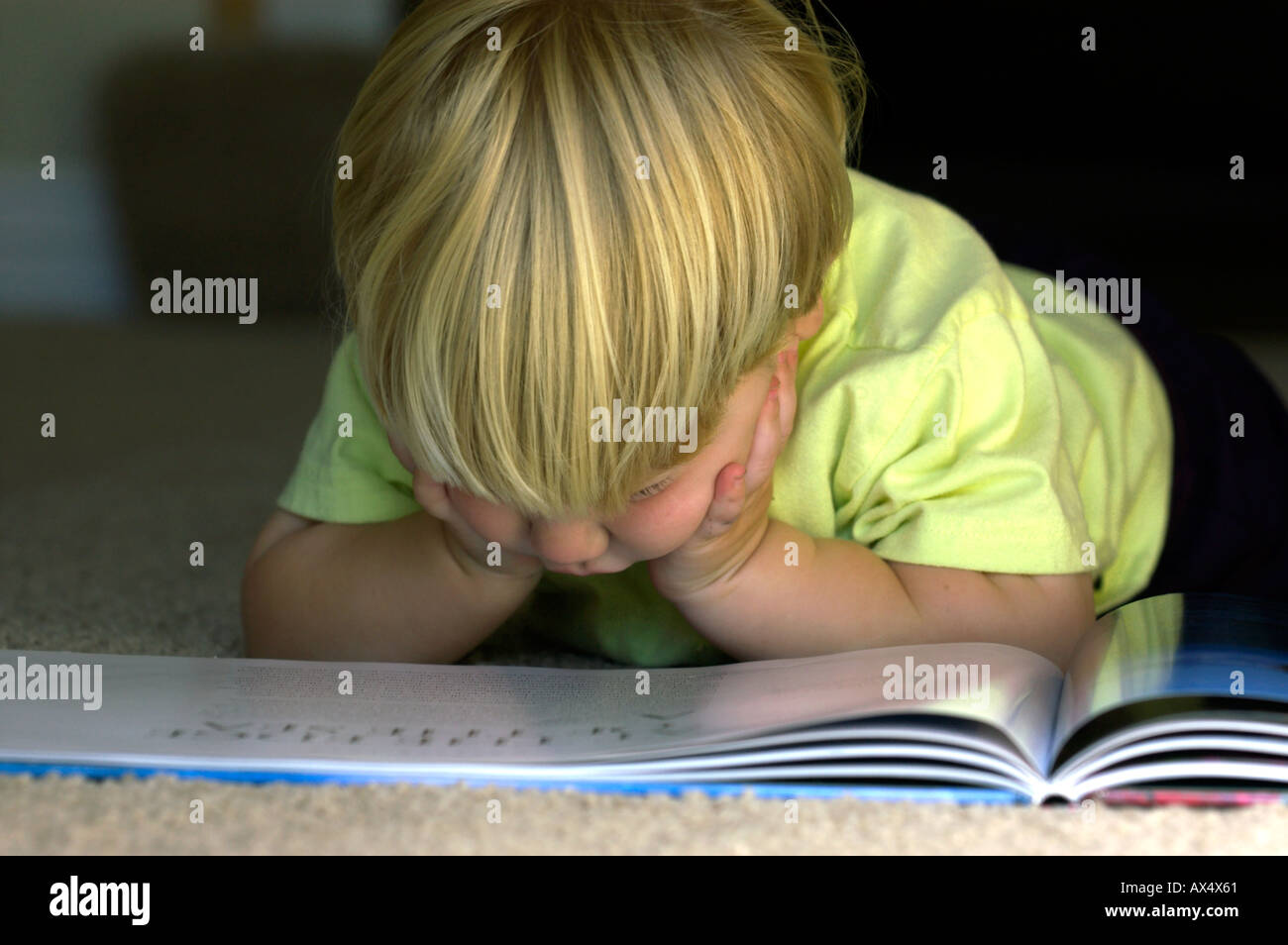 Book and child on floor hi-res stock photography and images - Alamy