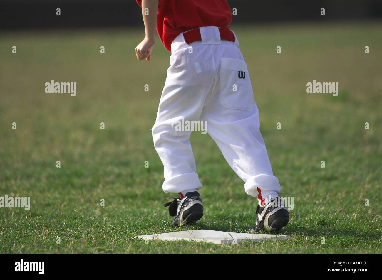 baseball boy running from base Stock Photo Alamy