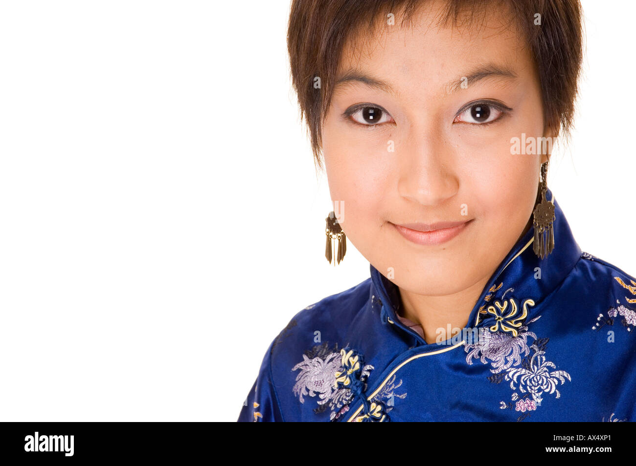 A Pretty Asian Woman Wears A Traditional Chinese Dress Called A Cheong a-pretty-asian-woman-wears-a-traditional-chinese-dress-called-a-cheong