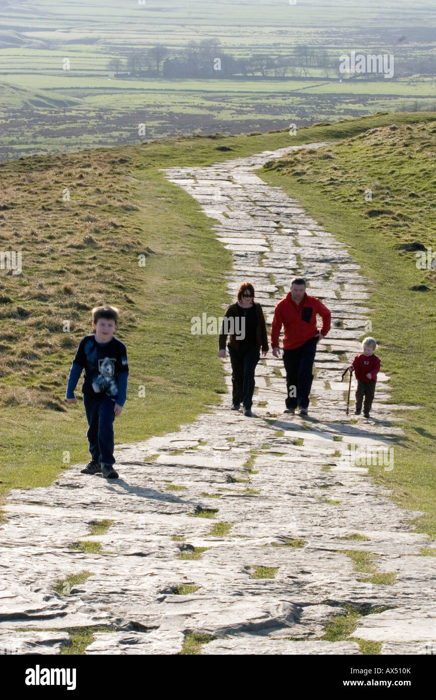 A family walking Mam Tor near Castleton in the Peak District National Park, Derbyshire, England, UK Stock Photo