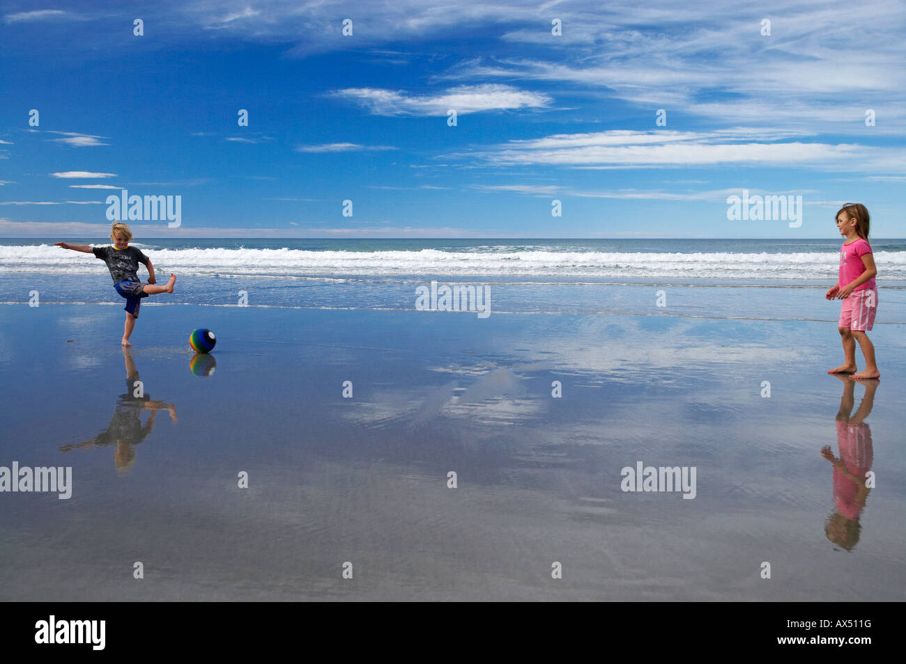 Children Playing Ball on a Beach near Taieri Mouth South of Dunedin South Island New Zealand
