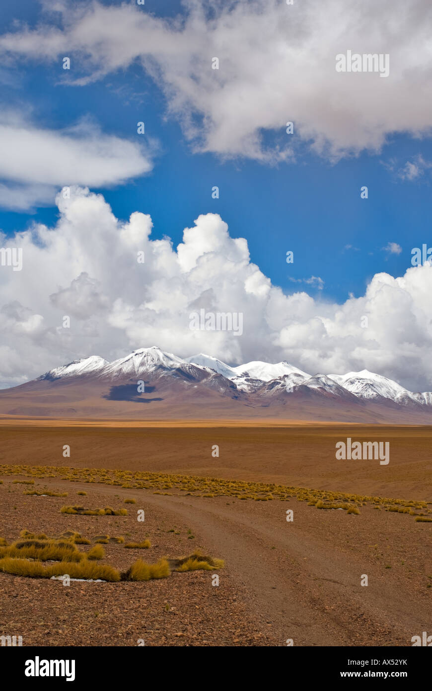 desert road white clouds and deep blue sky Stock Photo - Alamy