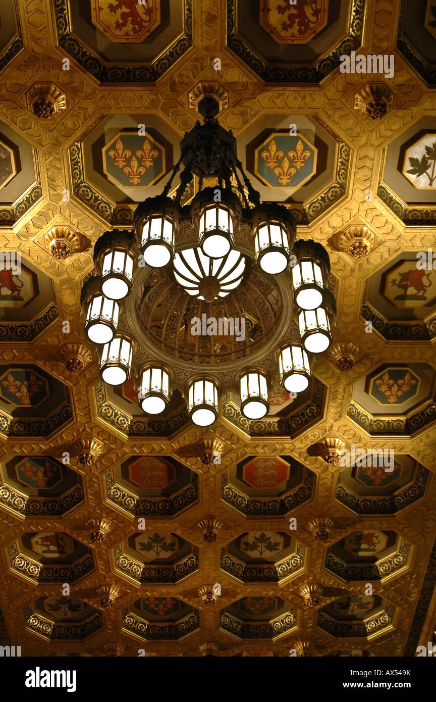 A large light fixture hangs from a ornate ceiling in Canada s