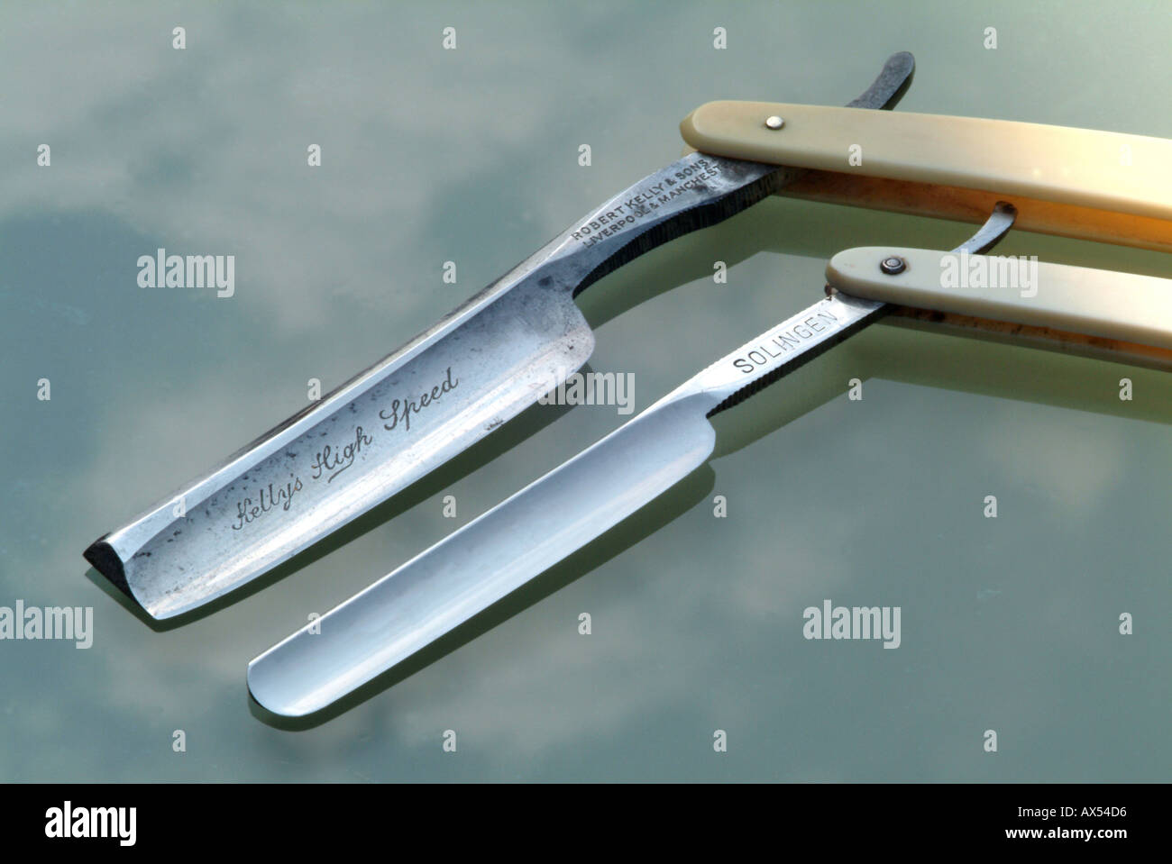 Two Old Cutthroat Razor Blades on a Glass Table Top Stock Photo Alamy