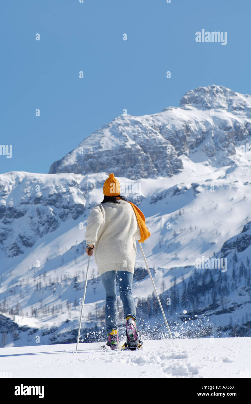Woman snowshoeing rear view hi-res stock photography and images - Alamy
