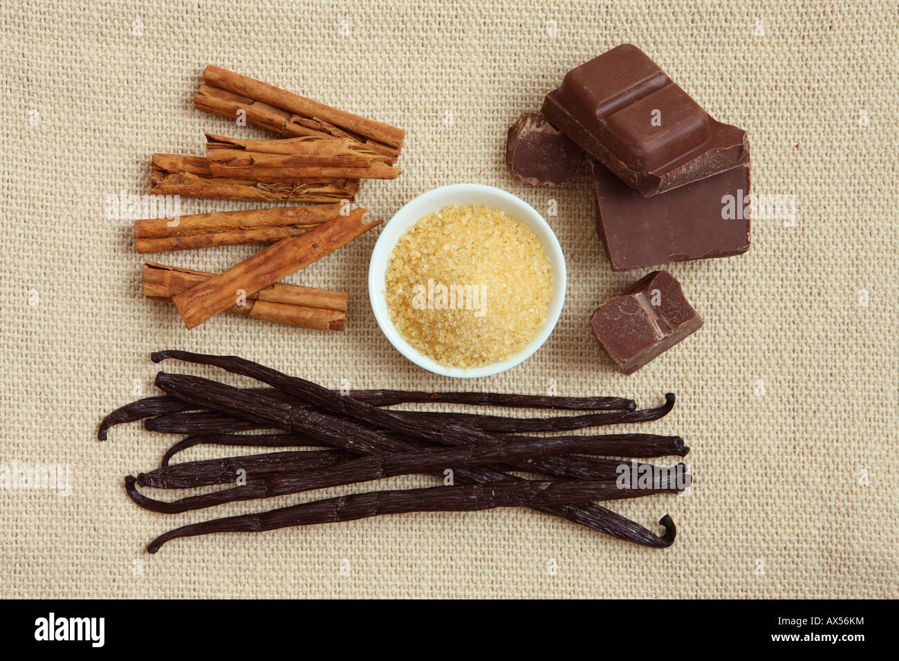 Natural Ingredients Cinnamon sticks Raw Sugar Milk Chocolate and Vanilla Pods Stock Photo