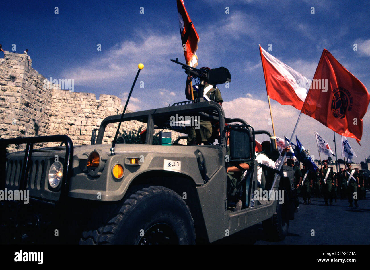 Israeli soldiers of the 35th Brigade also known as the Paratroopers Brigade parade in front of old city walls during Jerusalem day celebrations Stock Photo
