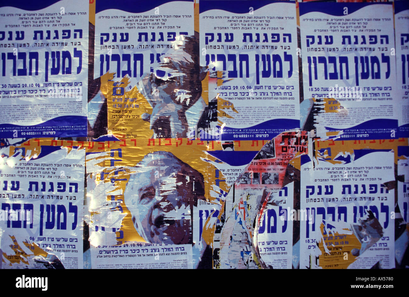 Torn placard figure of Prime Minister Yitzhak Rabin with posters calling for right wing rally supporting Jewish settlement in Hebron, Jerusalem Israel Stock Photo