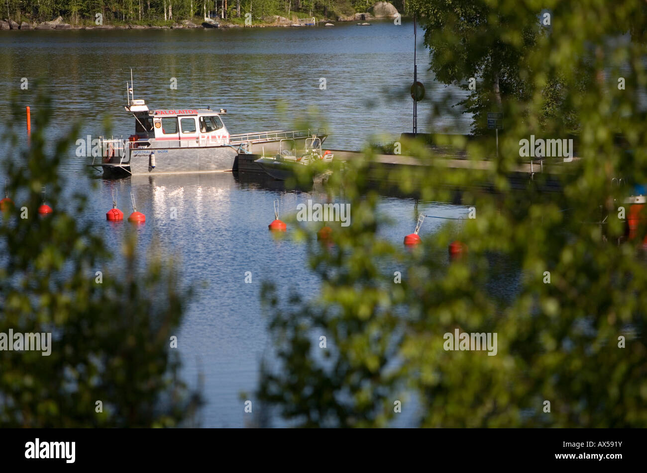 Fire department search and rescue vessel ( SAR ) moored at small boat harbor at lake Konnevesi at Summer , Finland Stock Photo