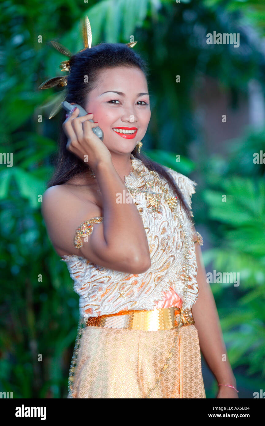 Thai girl on cellular phone Thailand Asia Stock Photo