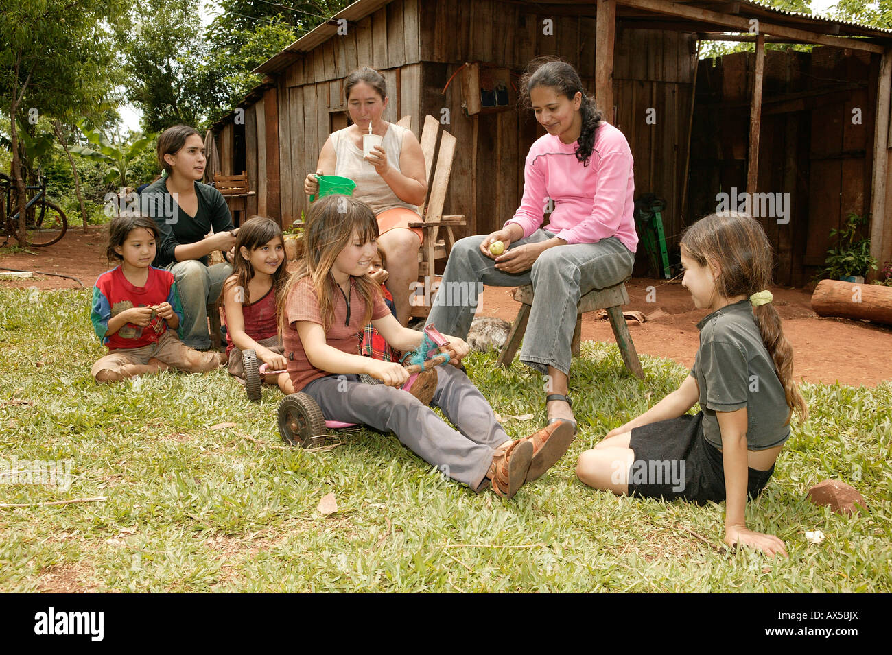 Work break in front of the house, women with children, Asuncion, Paraguay, South America Stock Photo