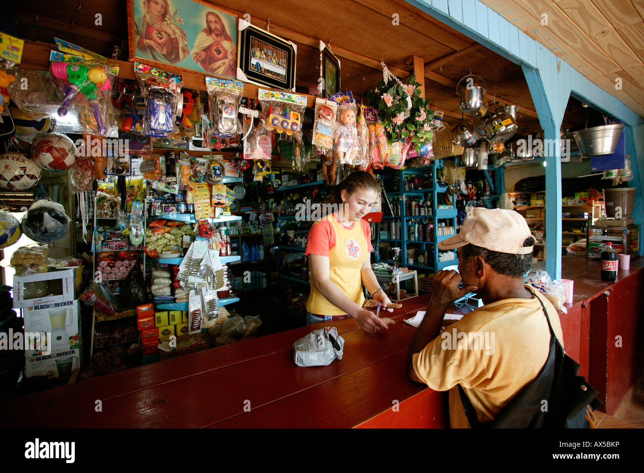 Woman in a general store with a customer, Asuncion, Paraguay, South America Stock Photo