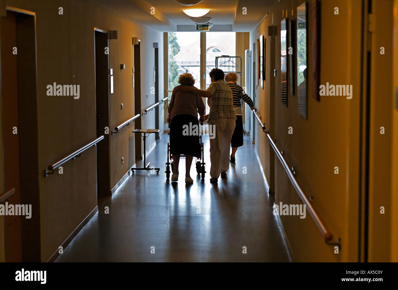 Nurse caring for old woman in a retirement home Stock Photo