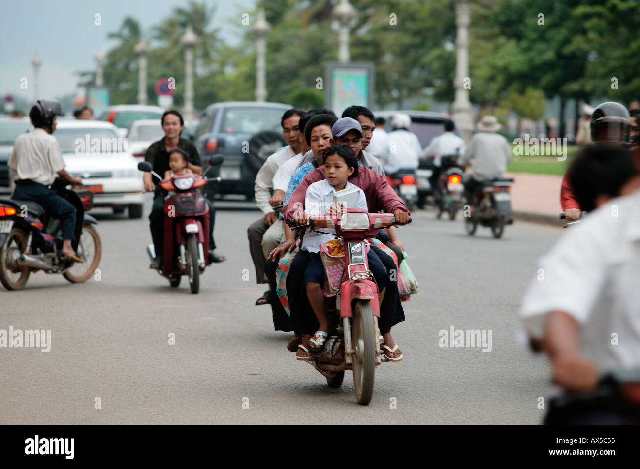 Family on motorcycle in Phnom Penh Cambodia Asia Stock Photo