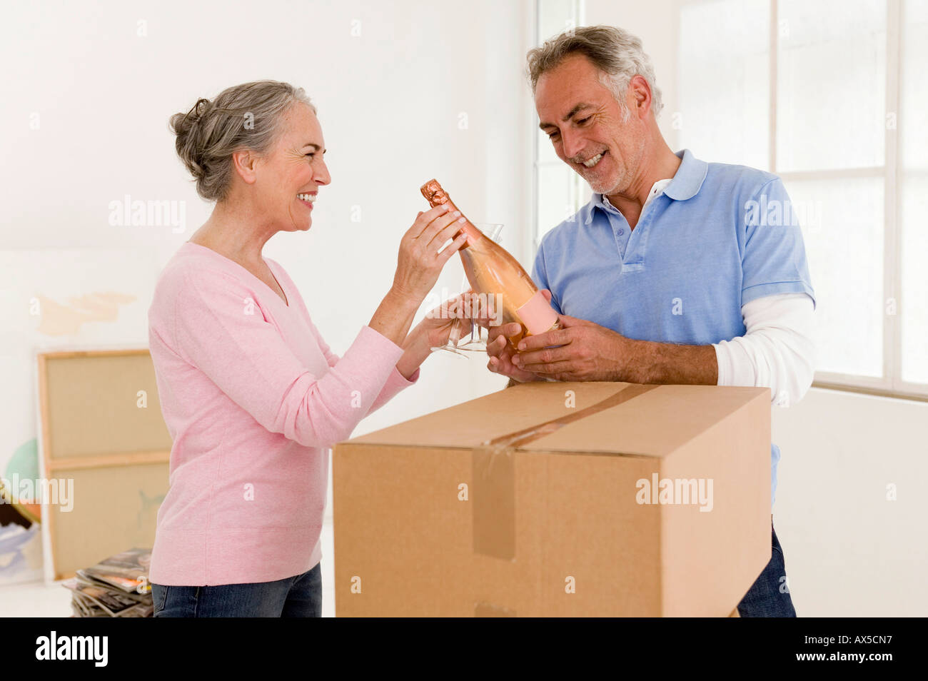 Two men holding up bottles hi-res stock photography and images - Alamy