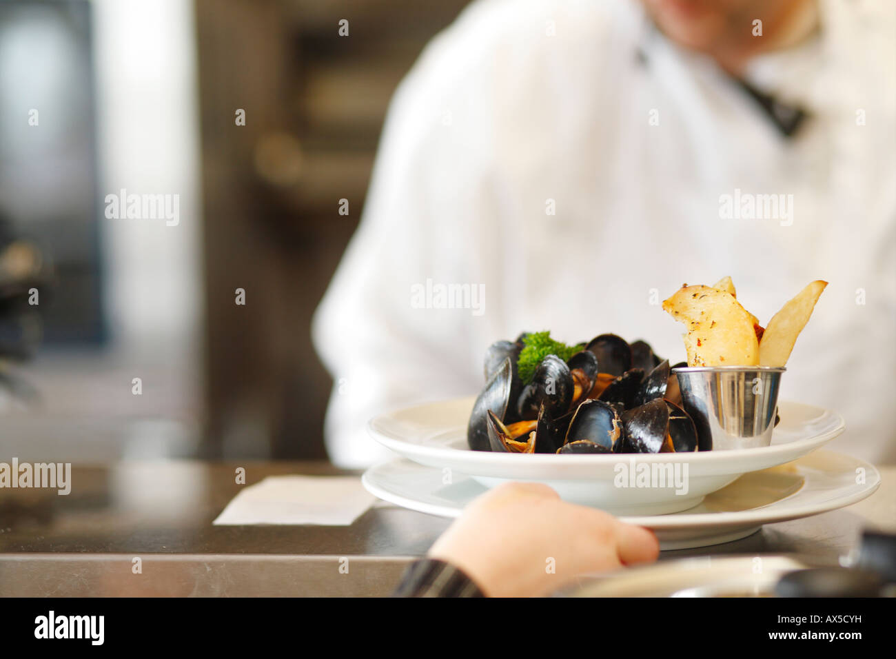 A plate of mussels prepared at the restaurant Stock Photo