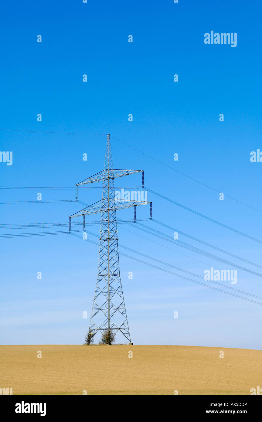 Transmission lines in a field Stock Photo