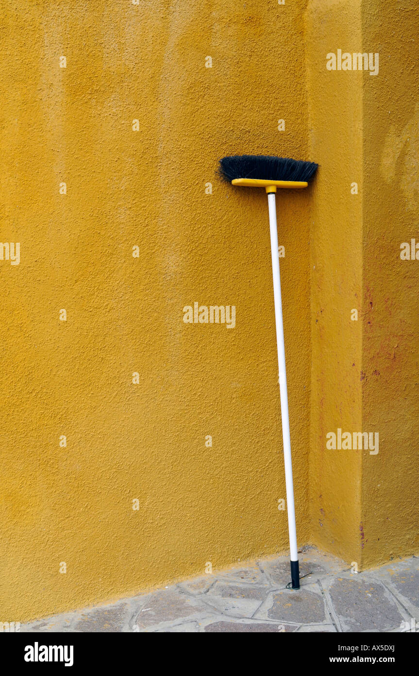Broom leaned up against a wall, Burano Island, Venice, Veneto, Italy, Europe Stock Photo