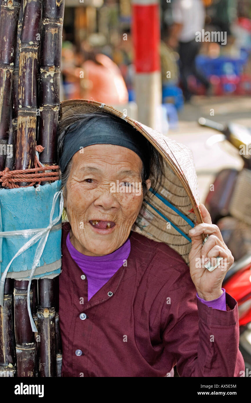 Old street vendor of sugarcanes in Hanoi, Vietnam Stock Photo
