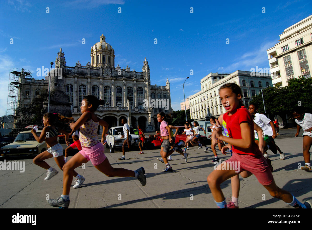 Children running in front of the Museum of the Revolution, Presidential Palace, Havana, Cuba, Caribbean Stock Photo