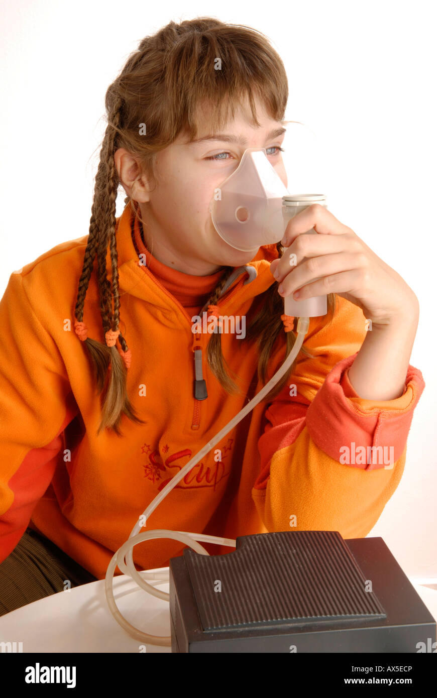 Girl using inhaler Stock Photo