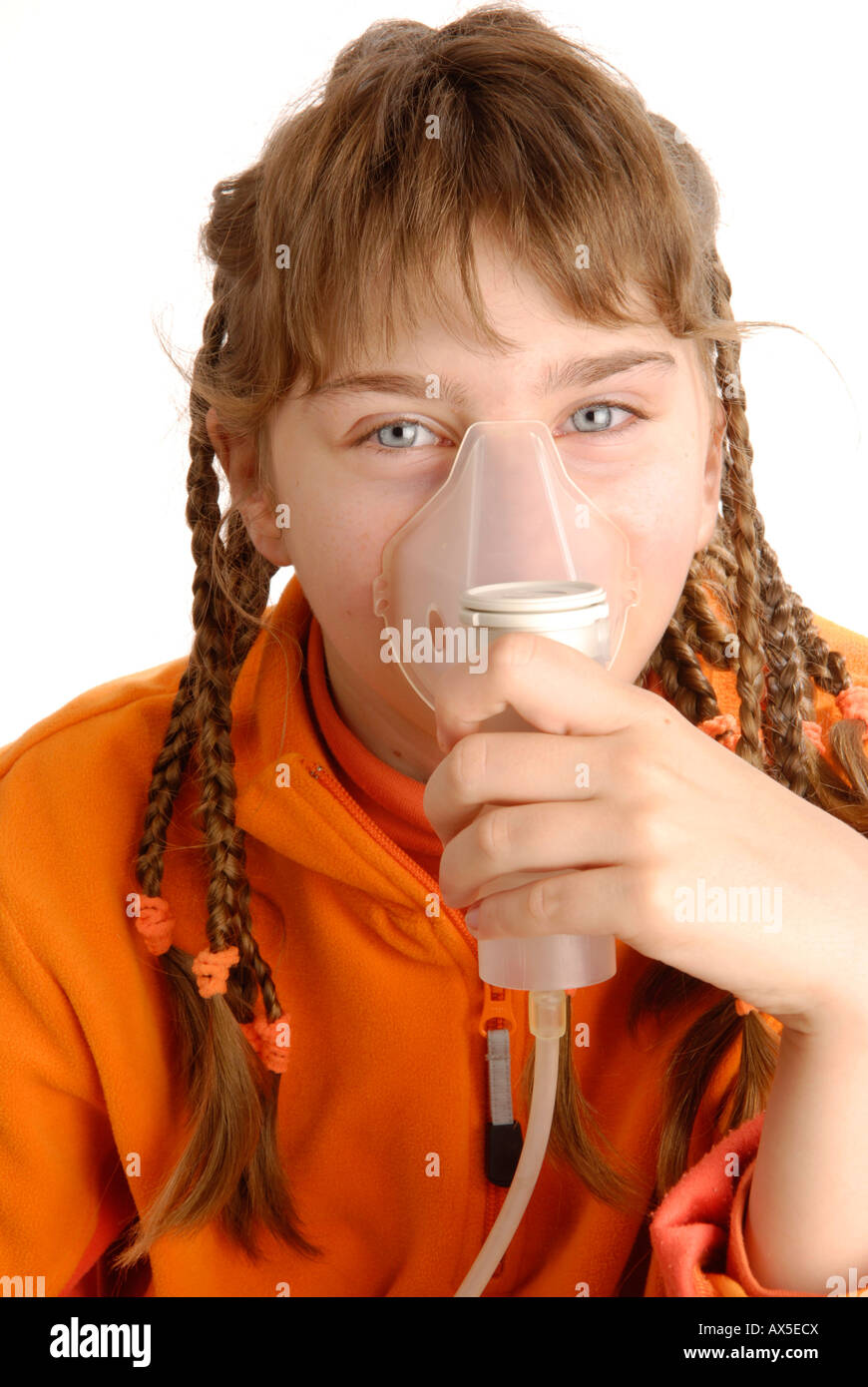 Girl using inhaler Stock Photo