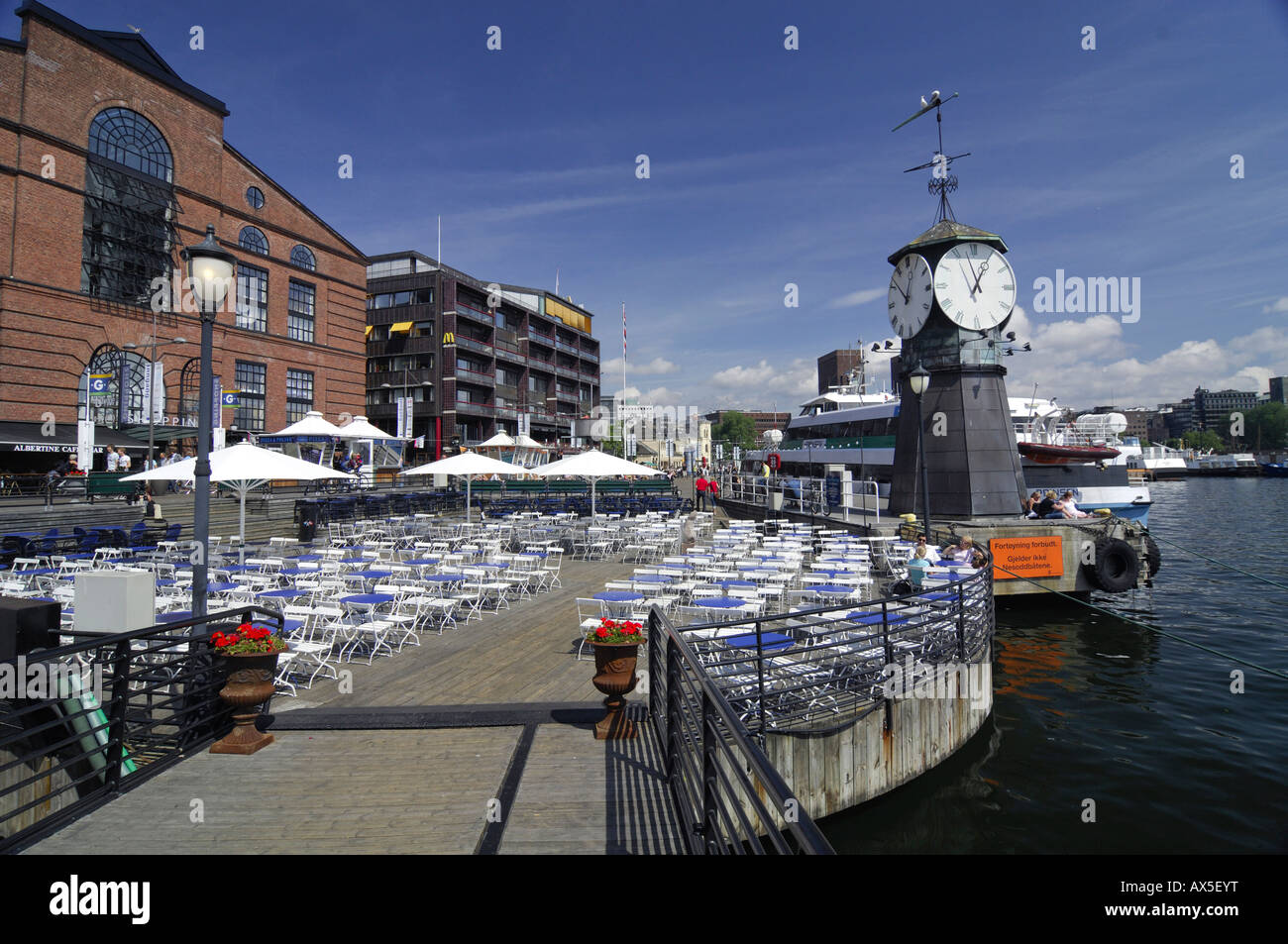 Clock tower and restaurant at the Aker Brygge shopping mall, Oslo, Norway, Scandinavia, Europe